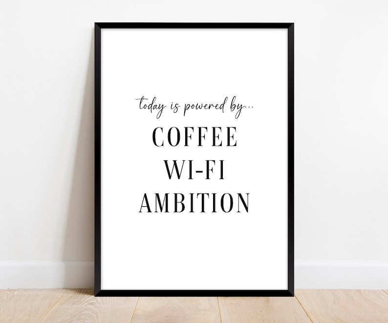 May include: Black and white typography print with the text "today is powered by... COFFEE WI-FI AMBITION"