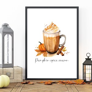 May include: A framed watercolor illustration of a pumpkin spice latte with whipped cream and cinnamon sticks. The text "Pumpkin spice season" is written below the latte.