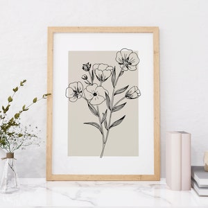 Pode incluir: Uma impress&atilde;o emoldurada com um desenho em preto e branco de um buqu&ecirc; de flores sobre um fundo marrom claro.