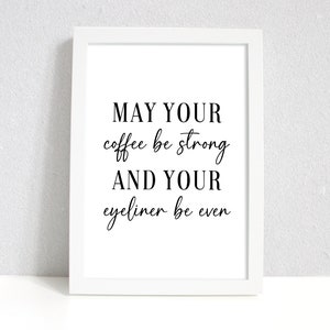 May include: White framed print with black text that reads "May your coffee be strong and your eyeliner be even".