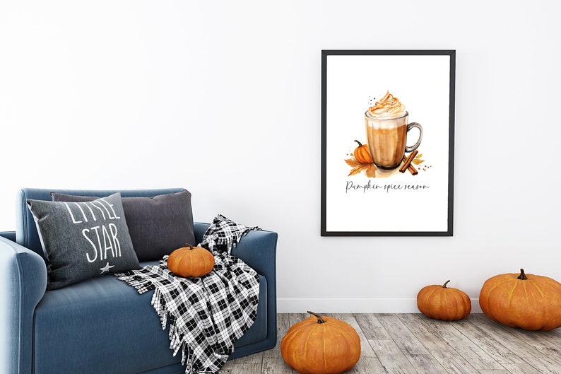 May include: A framed watercolor illustration of a pumpkin spice latte with whipped cream, a cinnamon stick, and a small pumpkin. The text "Pumpkin spice season" is written below the latte.