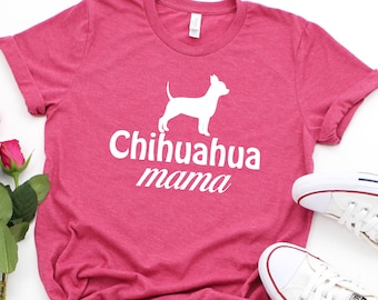 May include: A pink t-shirt with a white silhouette of a chihuahua and the text "Chihuahua mama".