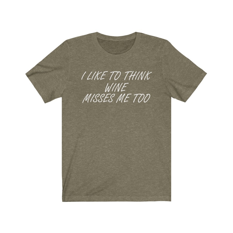May include: A green t-shirt with the text "I like to think wine misses me too" printed in white.