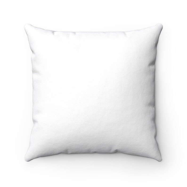 May include: A white square pillow with a smooth, soft fabric surface.