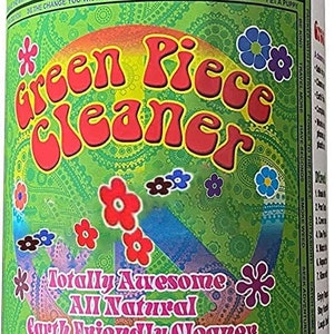 May include: A blue bottle of "Green Piece Cleaner" with a black cap. The label features a green background with floral designs and the words "Peace Love Happiness". The bottle contains 36oz of cleaner.