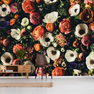 May include: A close-up image of a floral wall mural featuring a variety of white, pink, and orange flowers. The flowers are arranged in a random pattern and create a beautiful and vibrant design.