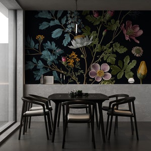 May include: A black dining table with six black chairs and a floral wallpaper featuring pink, white, and blue flowers on a dark background.