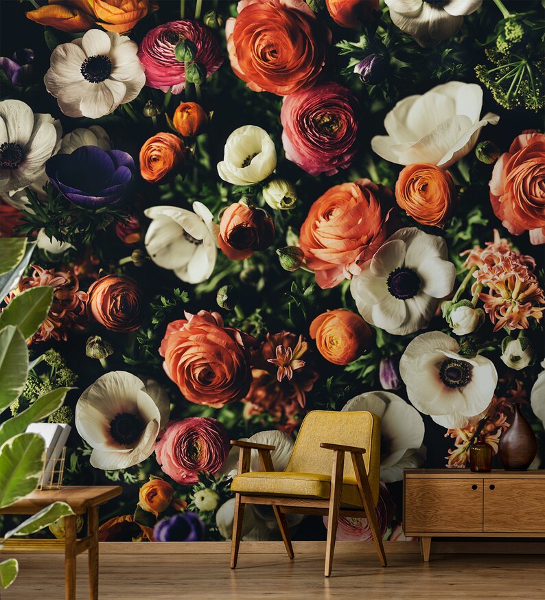 May include: A floral wallpaper mural featuring a close-up of a variety of colorful flowers, including white, pink, orange, and purple blooms. The flowers are arranged in a dense cluster, creating a vibrant and textured background.