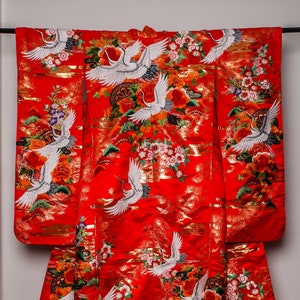Classical bright orange and golden Uchikake (wedding kimono) with cranes, fogbanks and pines