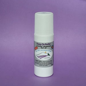 May include: White roll-on bottle with a lavender and magnesium blend. The label reads "Keep On Rollin' Lavender Magnesium Roll-on" and "Big Sky Lavender Farms".