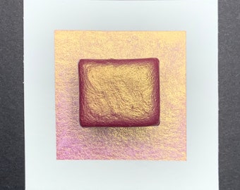May include: A single square pan of metallic gold watercolor paint with a red plastic case.