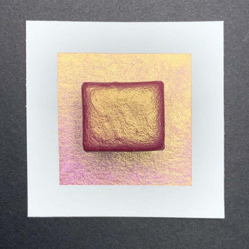 May include: A single square pan of metallic gold watercolor paint with a red plastic case.