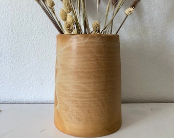 Terra-cotta colored 8 1/4 inch height by 6 inch canister with cork lid