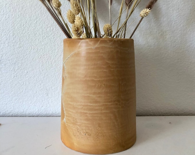 Terra-cotta colored 8 1/4 inch height by 6 inch canister with cork lid