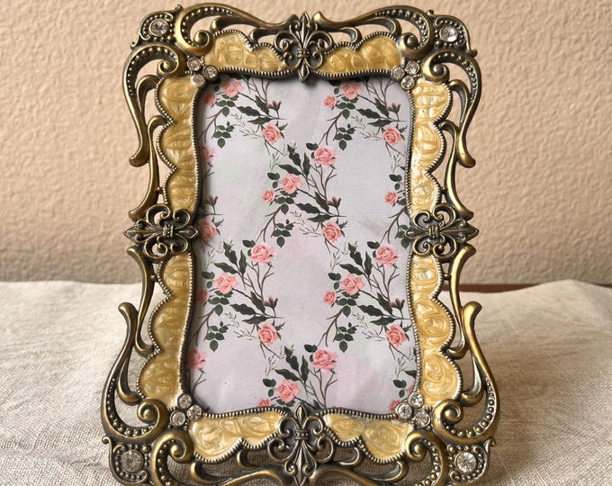 Vintage 8"x6" bronze and beige enameled frame with rhinestone details holds a 5 1/2 x 3 1/2 image