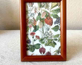 Vintage wood 6 3/4” x 5 3/4" frame with ornate details hold a 3 1/2 x 5 1/2” image