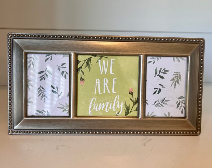Vintage silver frame holds two 2 x 3 images and one 3 x 3 image. The frame measures out to be 9 1/2 x 5