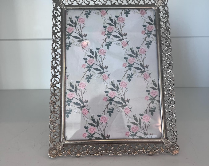Vintage brass 5x7 frame ( holds a 4 1/2" x 6 1/2" image)