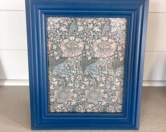 Vintage blue wood frame 13 1/2"x 11 1/2" hold a 7 1/2"x 9 1/2" image.  Hangs and stands both directions