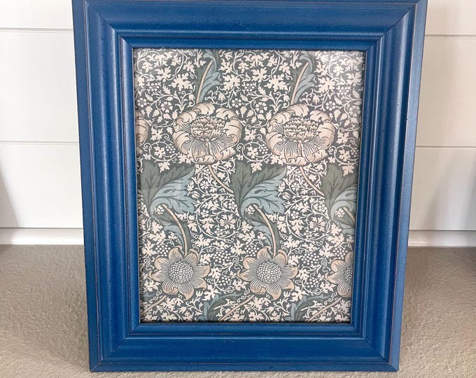Vintage blue wood frame 13 1/2"x 11 1/2" hold a 7 1/2"x 9 1/2" image.  Hangs and stands both directions