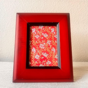 Vintage red with black border frame 6 1/2 x 8 holds a 3 1/4 x 4 1/2 inch photo