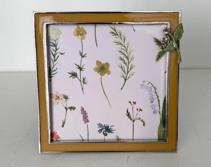 Vintage yellow frame with floral design 4 1/2” x4 1/2” frame holds a a 3 1/2”x3 1/2” photo