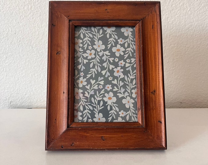 Wood 6 1/2 x 8 3/4 inch frame hold approximately a 3 1/2 x5 1/2 image.