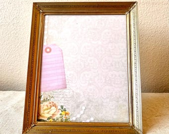 Vintage brass  11 1/2" x 9 1/2" frame with ornate etched detailing hold an 9 1/2" x 7 1/2" image