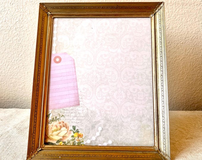 Vintage brass  11 1/2" x 9 1/2" frame with ornate etched detailing hold an 9 1/2" x 7 1/2" image