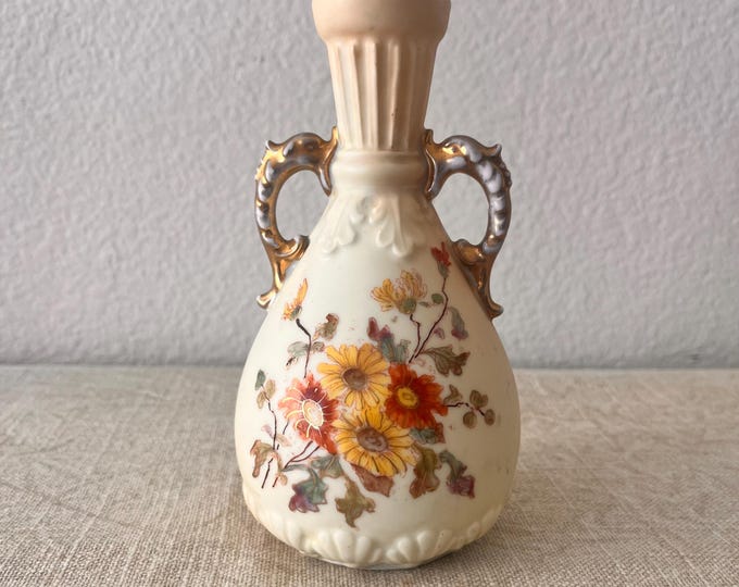Small vintage bud vase with floral details 6”H. x 3.5” W at bottom x 1 1/4” at top