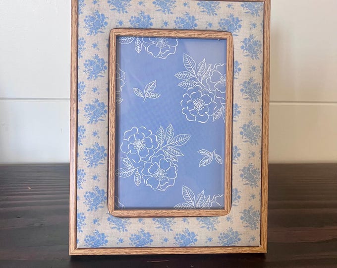 Vintage blue and white floral shabby chic fabric and wood frame 6 1/4"x 8 1/4" holds a 3 1/2"x 5 1/2' image. Hangs and stands