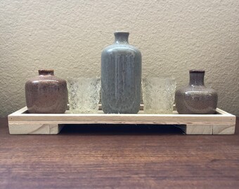 Vintage glass votives and vases on wood tray