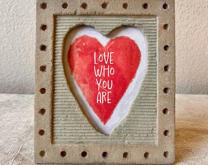 Vintage 6 3/4" x 5 3/4" frame with heart shaped window hold approximately 3x4 inch image