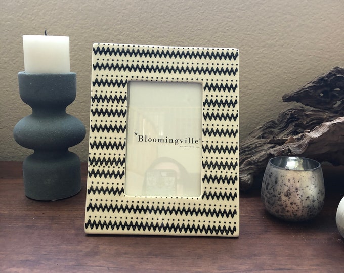Black and white geometric frame 7x9 holds a 4x6 photo