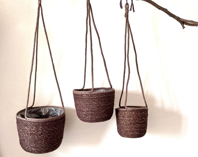 Charcoal gray hanging hand woven sea grass basket planters with plastic liner available in 3 sizes holds a 5 inch, 6 inch, 8 inch
