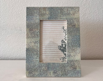 Vintage aqua and white frame 8 3/4" x 6 3/4" holds a 3 1/2"x5" image. Stands only both horizontal and vertical