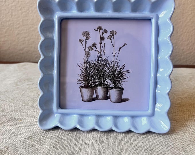 Vintage style blue 5 1/4” x 5 1/4” resin frame holda a 4”x4” photo