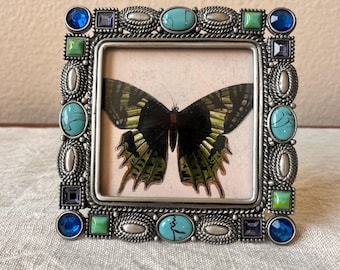 Vintage style silver 5x5 frame with turquoise and rhinestone detailing. Hold a 3 1/4” x 3 1/4” image.
