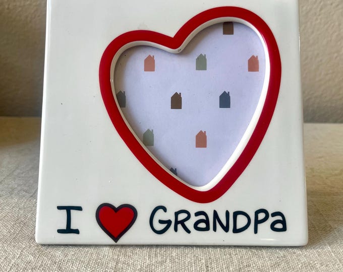 Vintage 6" x 6" frame with heart shaped window hold approximately 3 1/2 x4 inch image