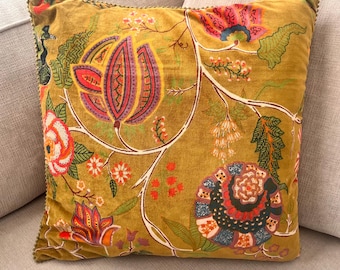 green velvet pillow with floral design motif 20” square