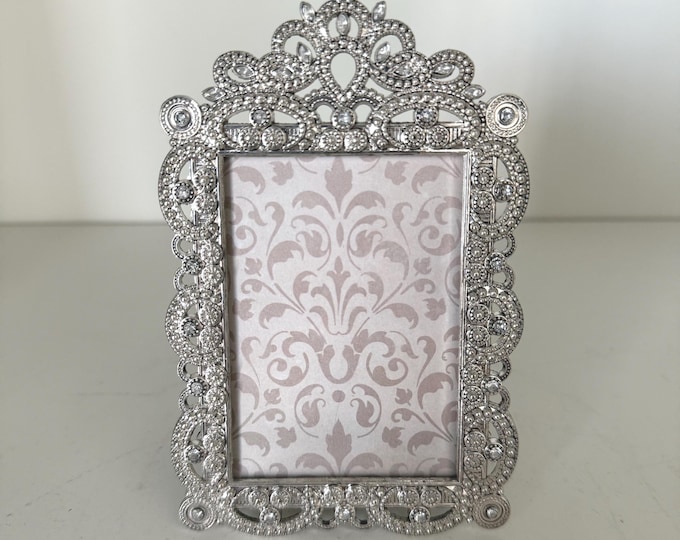 Vintage 3"x 5" frame with rhinestone detail holds a 2"x 3" image