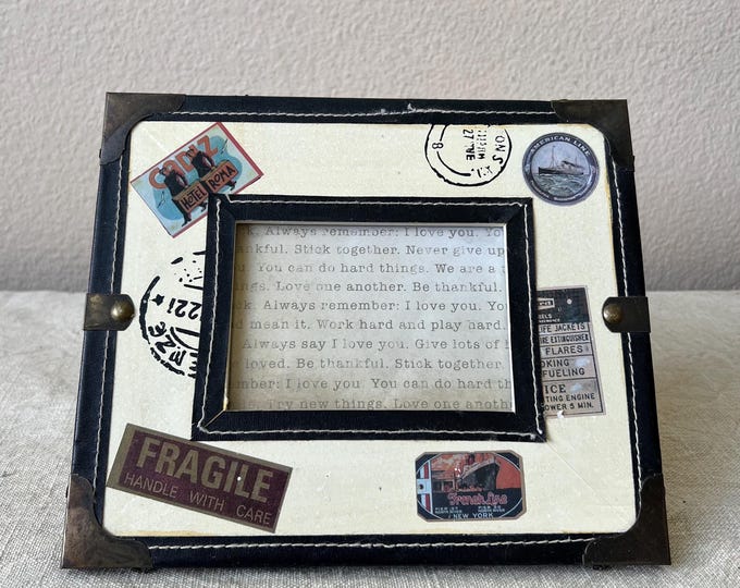 Vintage wood 9 1/4 x inch photo frame holds approximately a 4 1/2 x 3 1/4" image. Leather and wood details along with stamps. Stand only
