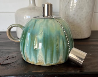 Green stoneware Oil Lamp with  handle & metal Insert 4 1/2" W x 5"H (Each One Will Vary)