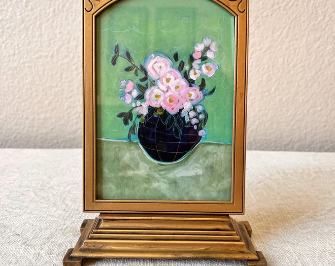 Victorian style 7 1/2x 5 brass picture frame holds a 3 1/2"x5 1/2" image