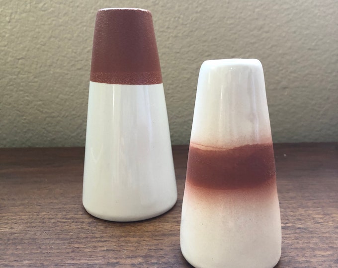 White and terra-cotta set up to bud vases