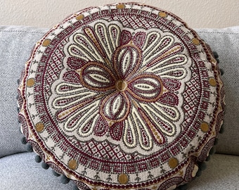 15” embroidered round  chambray pillow with Pom poms