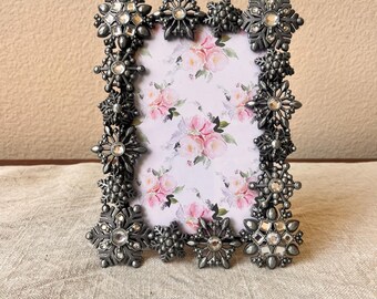 Vintage 7 1/2"x6" frame holds approximately a 4x6 image detailed with jeweled snowflake