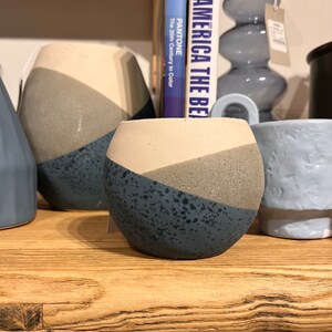 Sand  finished blue, tan and beige geometric pot  5 1/2” D x 4 3/4 H