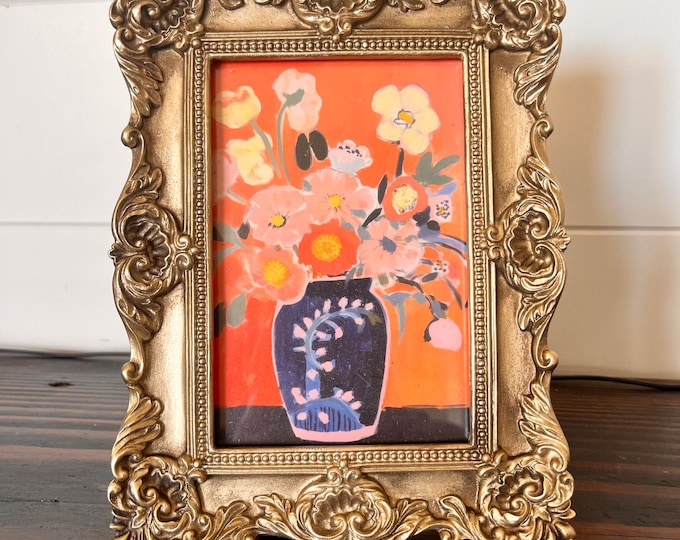 Victorian style 8"x6" gold frame holds a 3 1/2" x 5 1/2"image with etched detailing