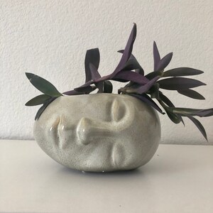 Beige ceramic face planter 6 3/4" L x 5 1/4" W  x 4" H